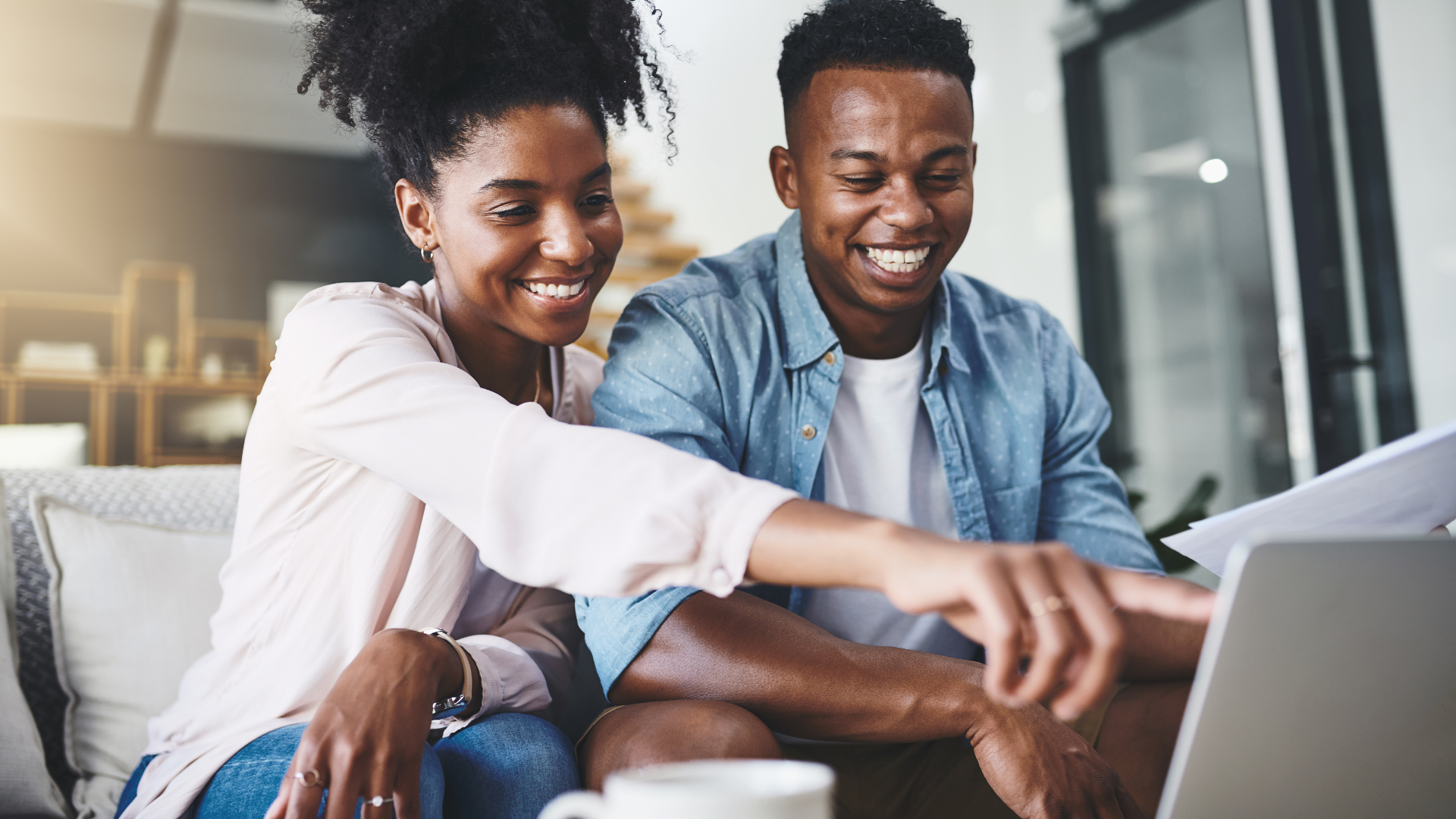 Woman and man looking at a laptop