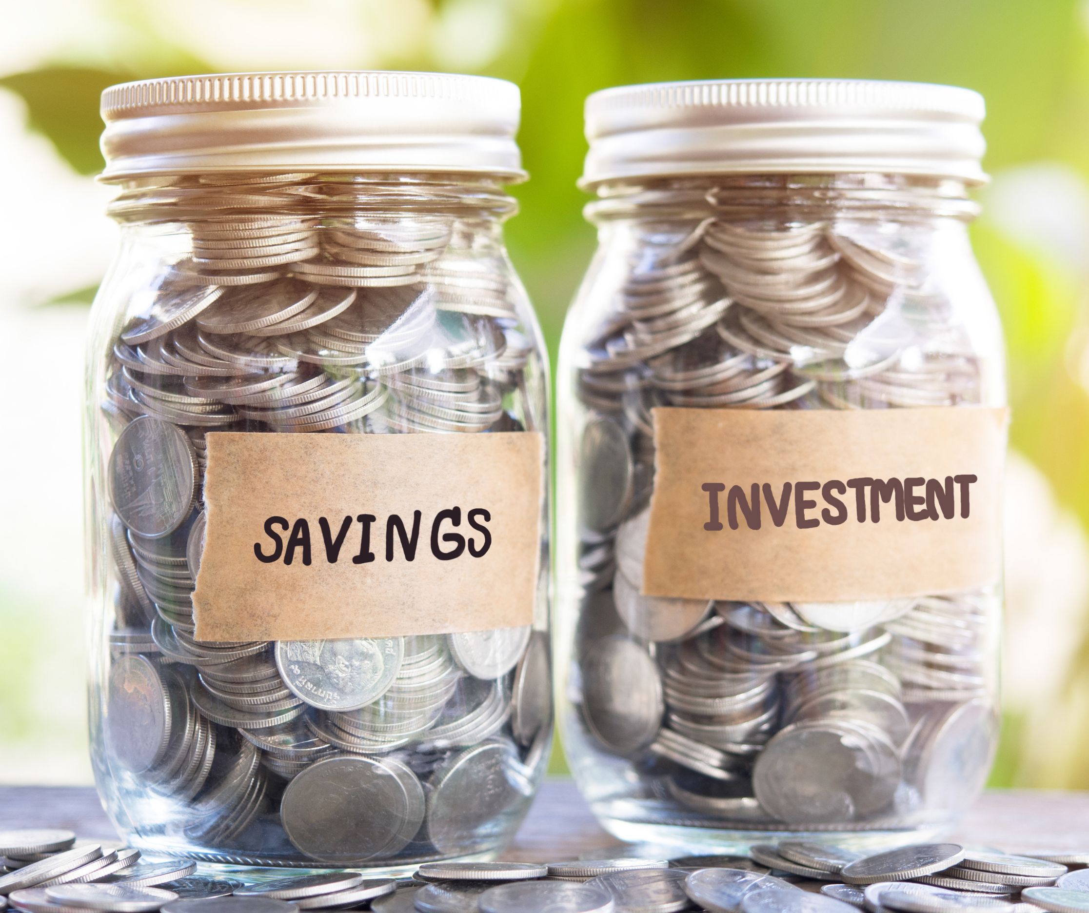 two glass jars filled with coins